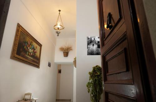 a hallway with a door and a picture on the wall at B & B Agrigento antica in Agrigento