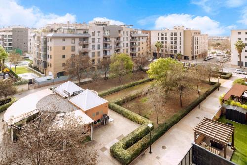 an aerial view of a city with tall buildings at EnjoyGranada EMIR 4C + Parking in Granada