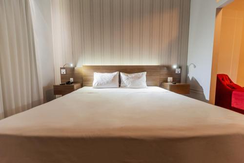 Postel nebo postele na pokoji v ubytování Ibis Styles Campinas Alphaville