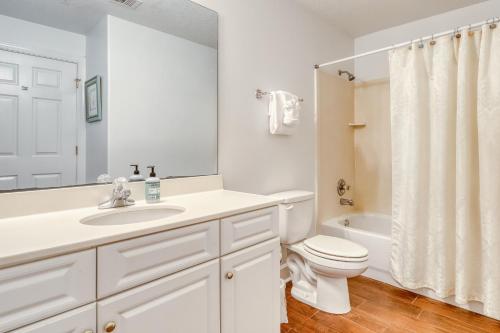 a white bathroom with a sink and a toilet at Ocean Villa 406 in Panama City Beach