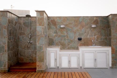 a bathroom with a sink and a shower at Sea Pearl Beachfront Villas - Anemone in Ayia Napa