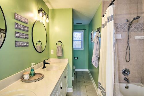 a green bathroom with two sinks and a shower at Norfolk Beach House Rental with Private Pool! in Norfolk