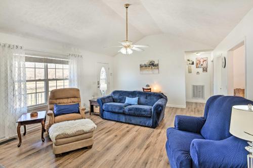 a living room with blue furniture and a couch at Normandy Home with Yard about 2 Mi to Lake in Tullahoma