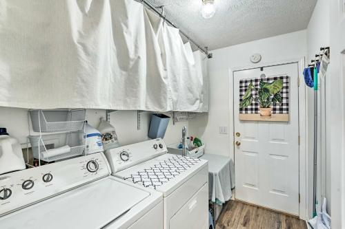 a kitchen with white appliances and a white door at Normandy Home with Yard about 2 Mi to Lake in Tullahoma