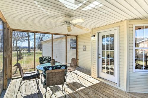 a patio with a table and chairs and a ceiling fan at Normandy Home with Yard about 2 Mi to Lake in Tullahoma