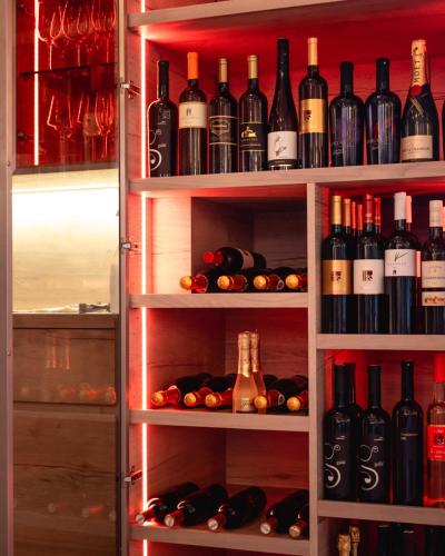 a refrigerator filled with lots of bottles of wine at Hotel & Restaurant Se-Mi in Veliko Trgovišće