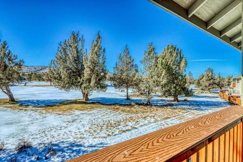a snow covered yard with trees and a fence at Golden Pheasant Nook in Redmond