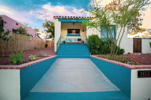 a walkway in front of a house with blue paint at Quail Cottage Clarkdale-Renovated Historic Cottage Sedona Jerome Wineries in Clarkdale