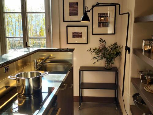 a kitchen with a sink and a counter top at Casa Santo Stefano in Cernobbio
