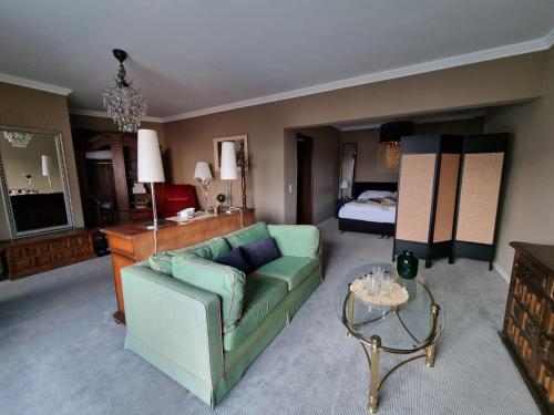 a living room with a couch and a bed at Boutique Centrale in Brione sopra Minusio