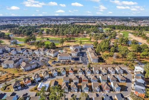an aerial view of a residential neighborhood with houses at Centrally Located Myrtle Beach House Near Sports Center, Broadway at the Beach, Shopping, Beach, and Golf in Myrtle Beach