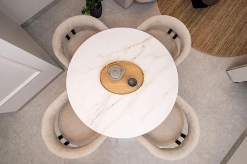 a white marble table with two spheres on it at Lovely 1 bedroom apt w/pool. Haneviim st jerusalem in Jerusalem
