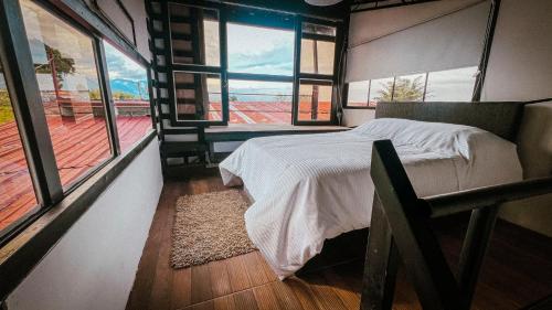Postel nebo postele na pokoji v ubytování INLOFT Quindío