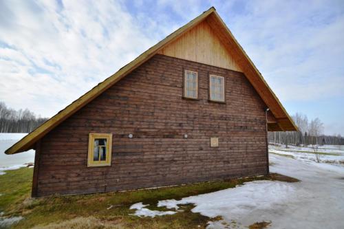 a small brick building with a pitched roof at Līgatnes Zemturi in Augšlīgatne