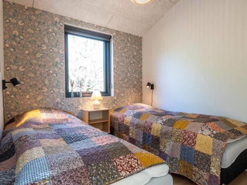 Giường trong phòng chung tại Holiday home Fanø CC