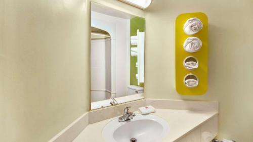 a bathroom with a sink and a mirror at Motel 6-Lake Havasu, AZ - Lakeside in Lake Havasu City