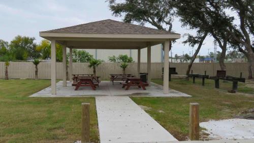 a pavilion with picnic tables and benches in a park at Motel 6-Rockport, TX in Rockport