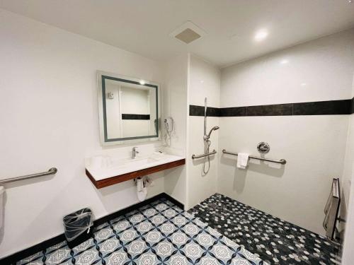 a bathroom with a sink and a mirror at Motel 6 Vallejo, CA - Napa Valley in Vallejo