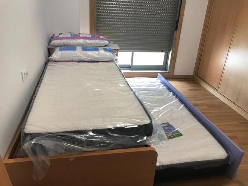 Katil atau katil-katil dalam bilik di APARTAMENTO PLAYA A XUNQUEIRA, a 15 min Vigo
