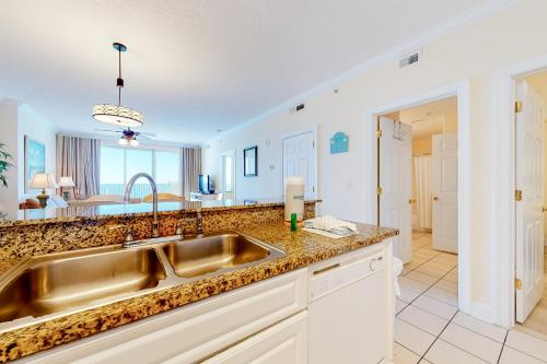 a kitchen with a sink and a counter at Ocean Villa 1706 in Panama City Beach