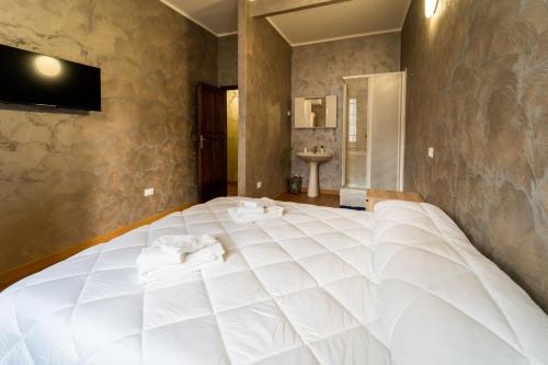Postel nebo postele na pokoji v ubytování B&B Sasso