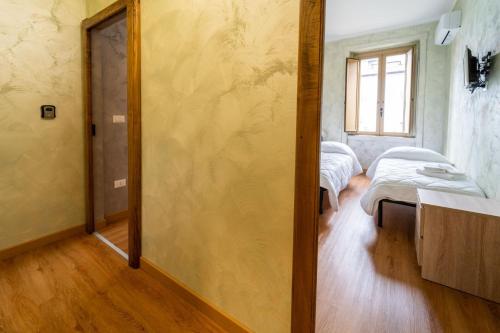 Postel nebo postele na pokoji v ubytování B&B Sasso