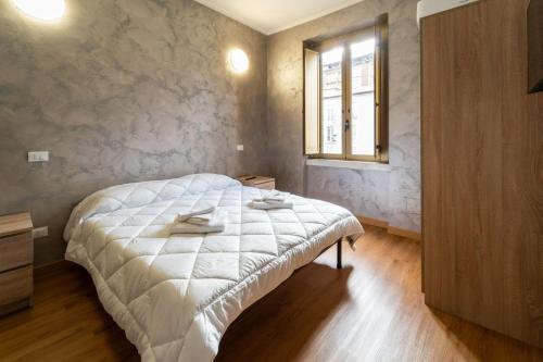 Postel nebo postele na pokoji v ubytování B&B Sasso