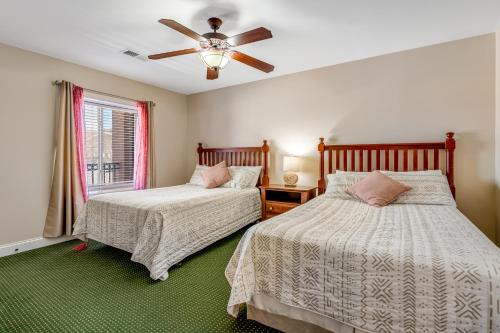 a bedroom with two beds and a ceiling fan at Bon Air Unit 4032 in Gatlinburg