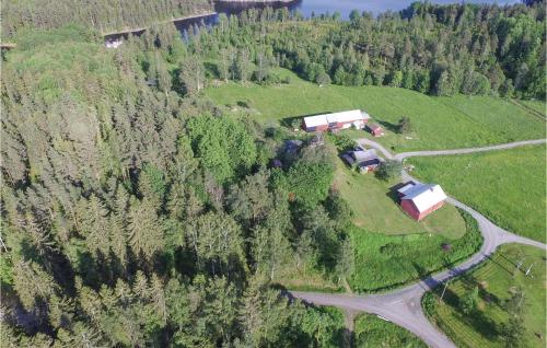 an aerial view of a farm in the middle of a forest at 2 Bedroom Nice Home In Årjäng in Årjäng