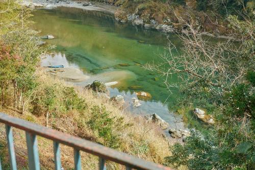 a view of a river from a bridge at 目の前が吉野川・雨天でも屋外体験ができる絶景の一軒家 in Ōtakuchi