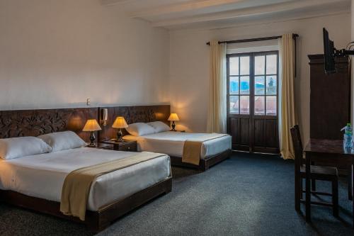 Postel nebo postele na pokoji v ubytování La Xalca Hotel - Asociado Casa Andina