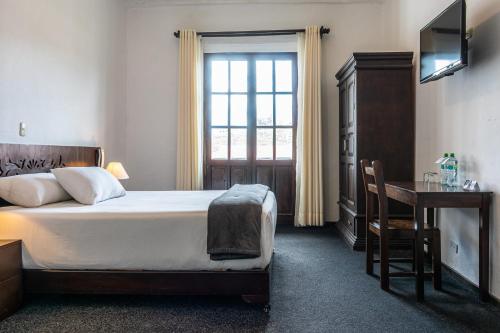 Postel nebo postele na pokoji v ubytování La Xalca Hotel - Asociado Casa Andina