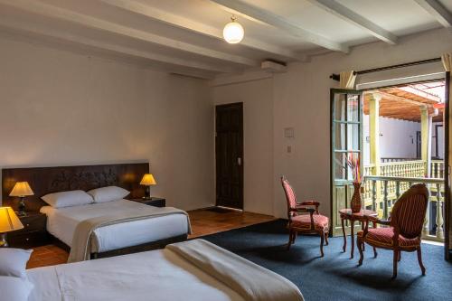 Postel nebo postele na pokoji v ubytování La Xalca Hotel - Asociado Casa Andina