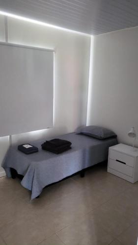 Katil atau katil-katil dalam bilik di Complejo de casas en Pueblo Centenario