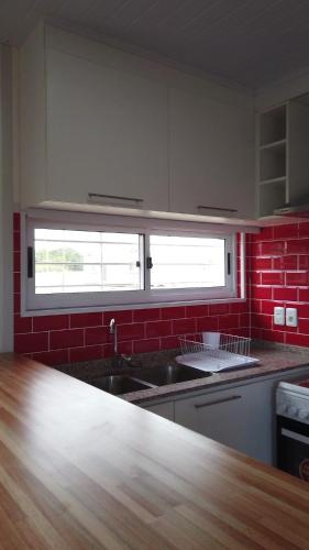 Dapur atau dapur kecil di Complejo de casas en Pueblo Centenario