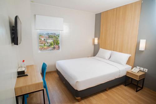 Postel nebo postele na pokoji v ubytování Hotel Citradream Bandung