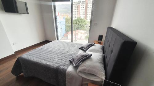 Кровать или кровати в номере Parque Central