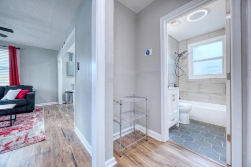 a bathroom with a tub and a toilet in a room at Cozy Home with City Views in Columbus
