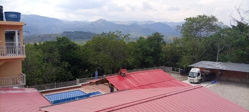 a view of a building with red roofs and a truck at BONANZA in Monterrey