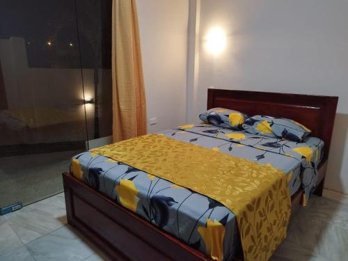 Una cama o camas en una habitación de Kánela Hotel - Cabañas