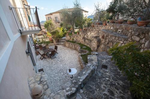 an overhead view of a stone courtyard with a table at B&B Le Viole in Arce