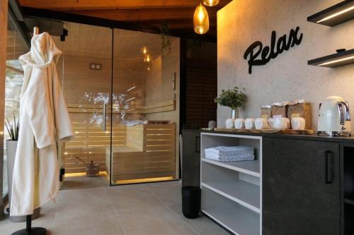 a bathroom with a sink and a shower in a room at Sibenbras Natural Aparthotel in Limone sul Garda