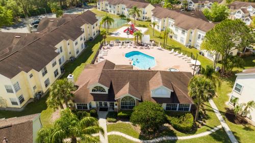 an aerial view of a house with a swimming pool at Beautiful, cozy and spacious Retreat near Disney in Kissimmee