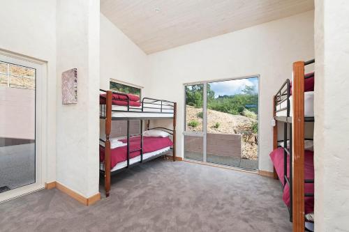 a room with two bunk beds and a window at Eagle Ridge in Hordern Vale