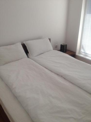 En eller flere senge i et værelse på Apartment in Sunny Day 6