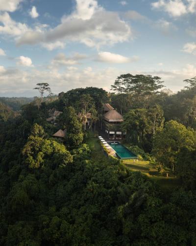 an aerial view of a resort in the jungle at Alila Ubud in Ubud
