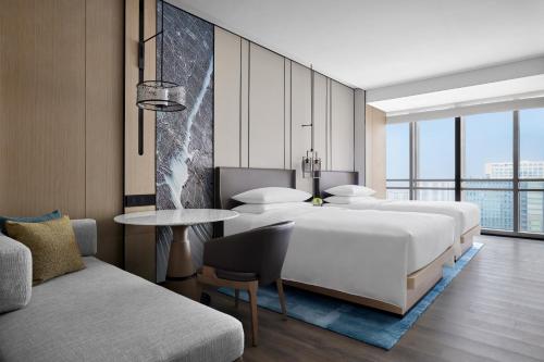 Postel nebo postele na pokoji v ubytování Changzhou Marriott Hotel Jintan