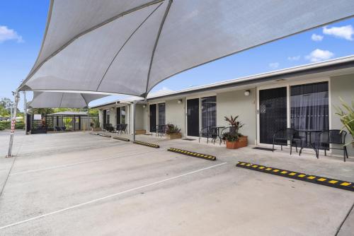 a large patio with awning on a building at Caboolture Central Motor Inn, Sure Stay Collection by BW in Caboolture