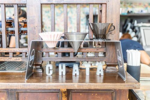 a coffee machine on a counter in a store at Baan 2459 Heritage House in Bangkok