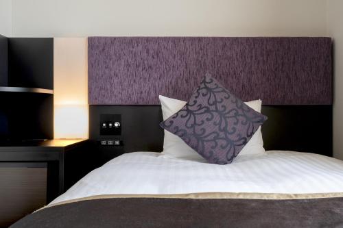 Katil atau katil-katil dalam bilik di Hotel Vista Hiroshima